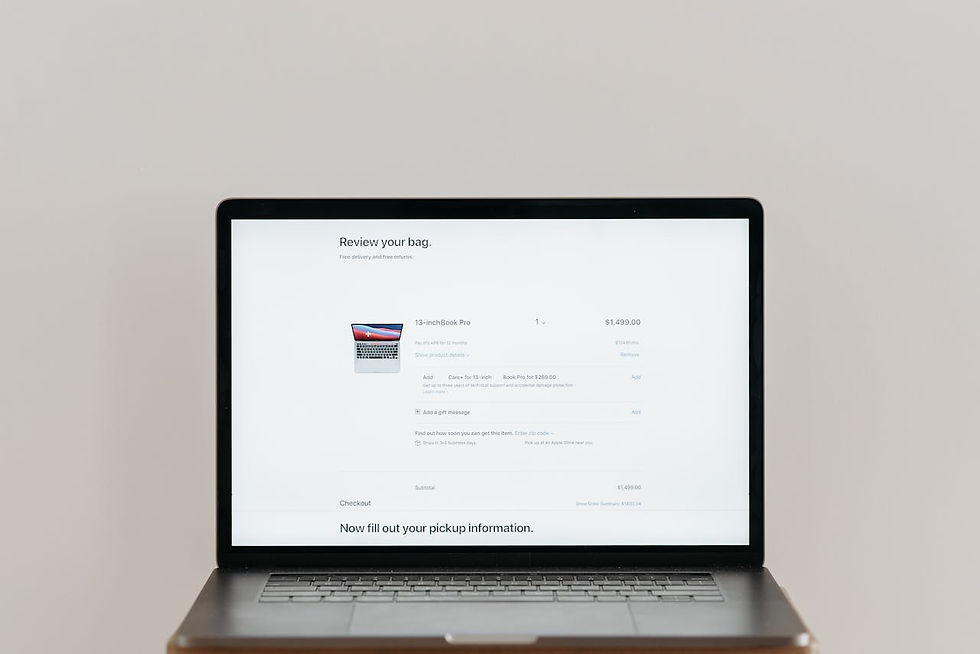 Minimalist laptop showing an online checkout screen on a white background, ideal for tech context.