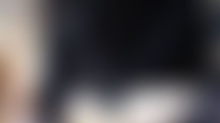 Close-up of a condenser microphone in a studio setting, ideal for podcasts and audio recording.