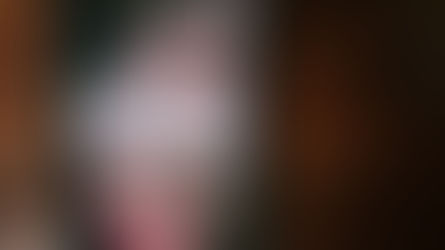 Close-up of a smartphone displaying a bank alert notification on a wooden table.