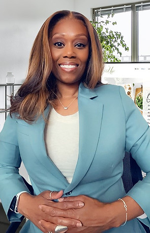 Zana in an office folded hands.jpg