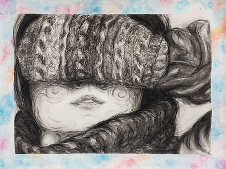 A student work sample of a caringly rendered portrait of a woman covering her eyes with a mitten. The textures have been captured in charcoal using soft and flowing marks.