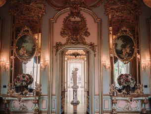 Hall of Mirrors interior with gilded baroque decorations and floral arrangements at Villa Cora Florence wedding venue