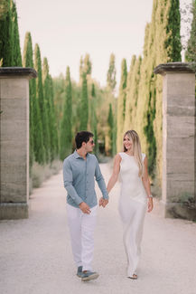 Couple walking hand-in-hand, smiling, Alyssa and Sean – elopement at Belmond Villa San Michele Florence.