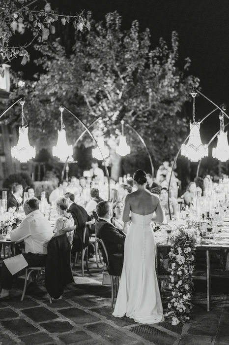 Evening wedding reception under lights at La Corbinaia