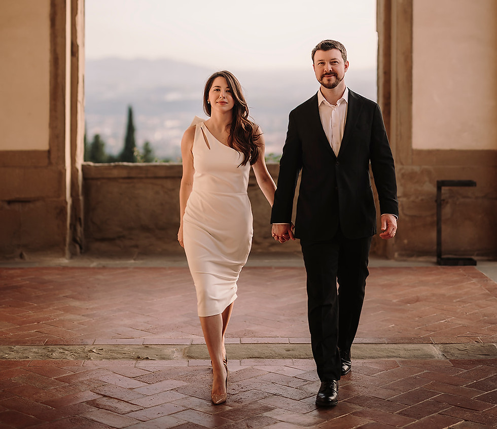Couple walking hand in hand on the terrace of Belmond Villa San Michele Florence elopement