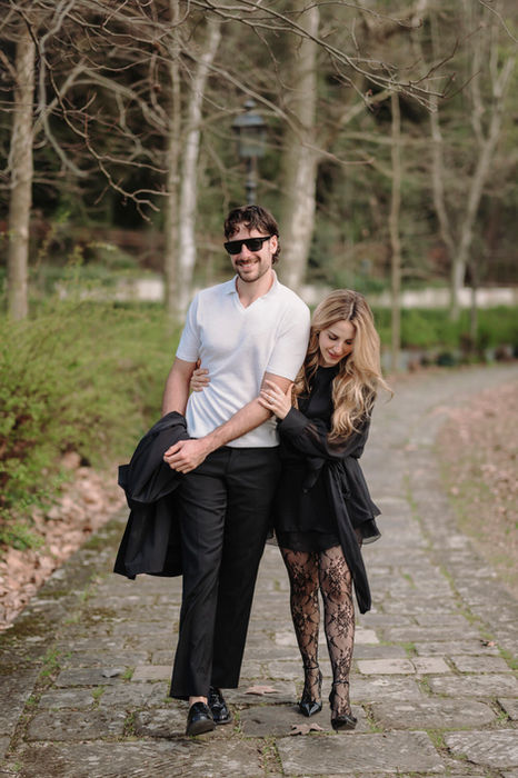 Couple walking together in the gardens of Florence intimate portrait session