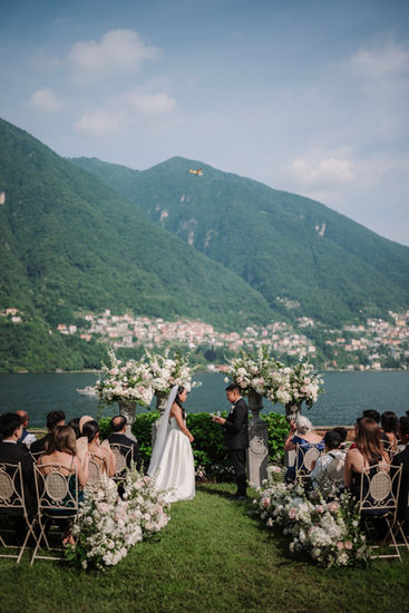 Garden wedding ceremony with floral arch and Lake Como panorama, Villa Regina Teodolinda, destination wedding