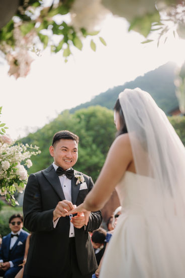 Bride and groom exchanging rings during the ceremony, Villa Regina Teodolinda, Lake Como