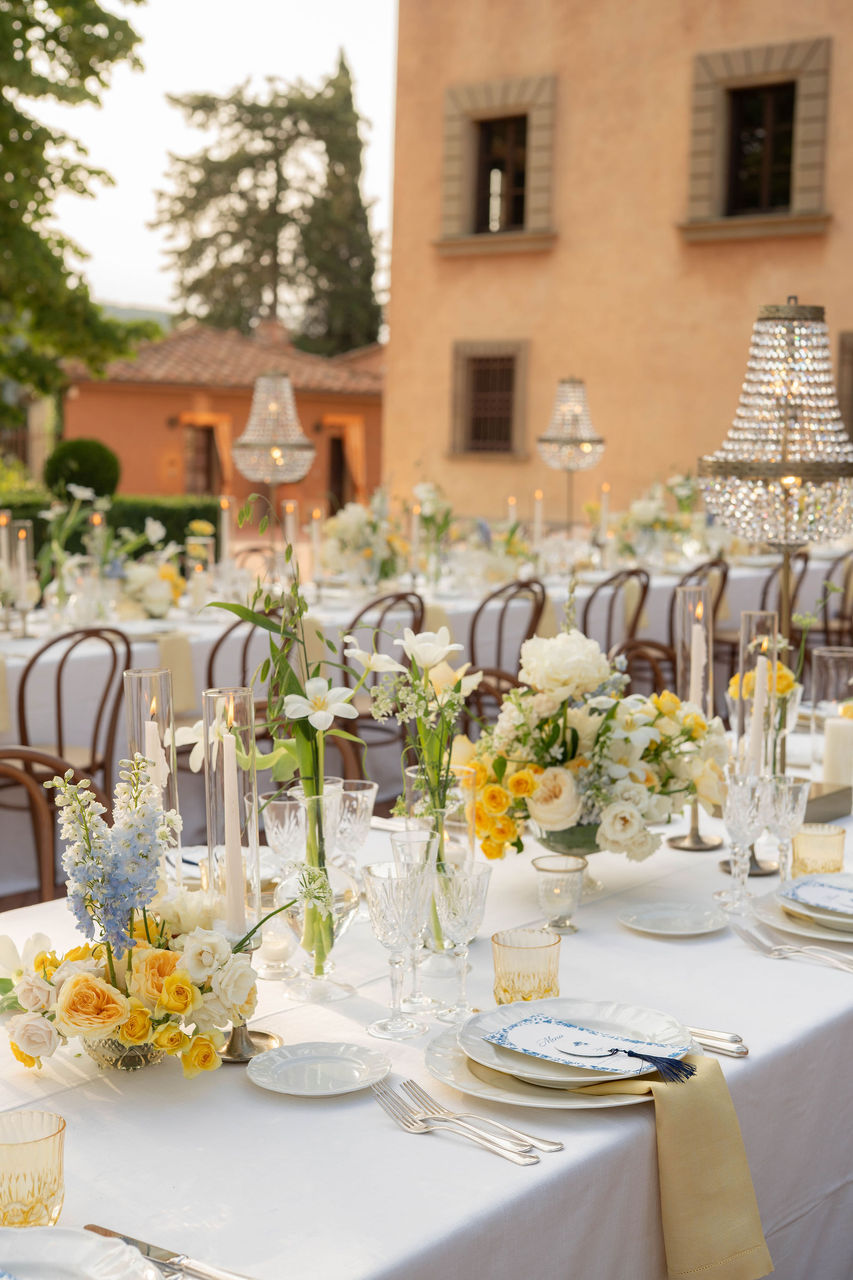 outdoor wedding reception setup with elegant floral arrangements