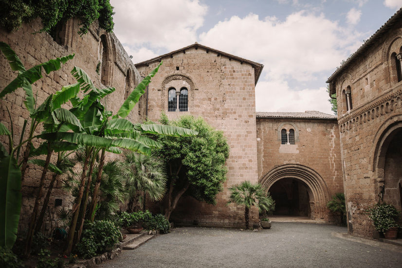 Exterior view of La Badia di Orvieto, elegant and historic building with courtyard.