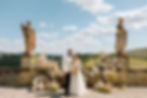 elegant wedding floral installation with couple in Tuscan landscape with statues