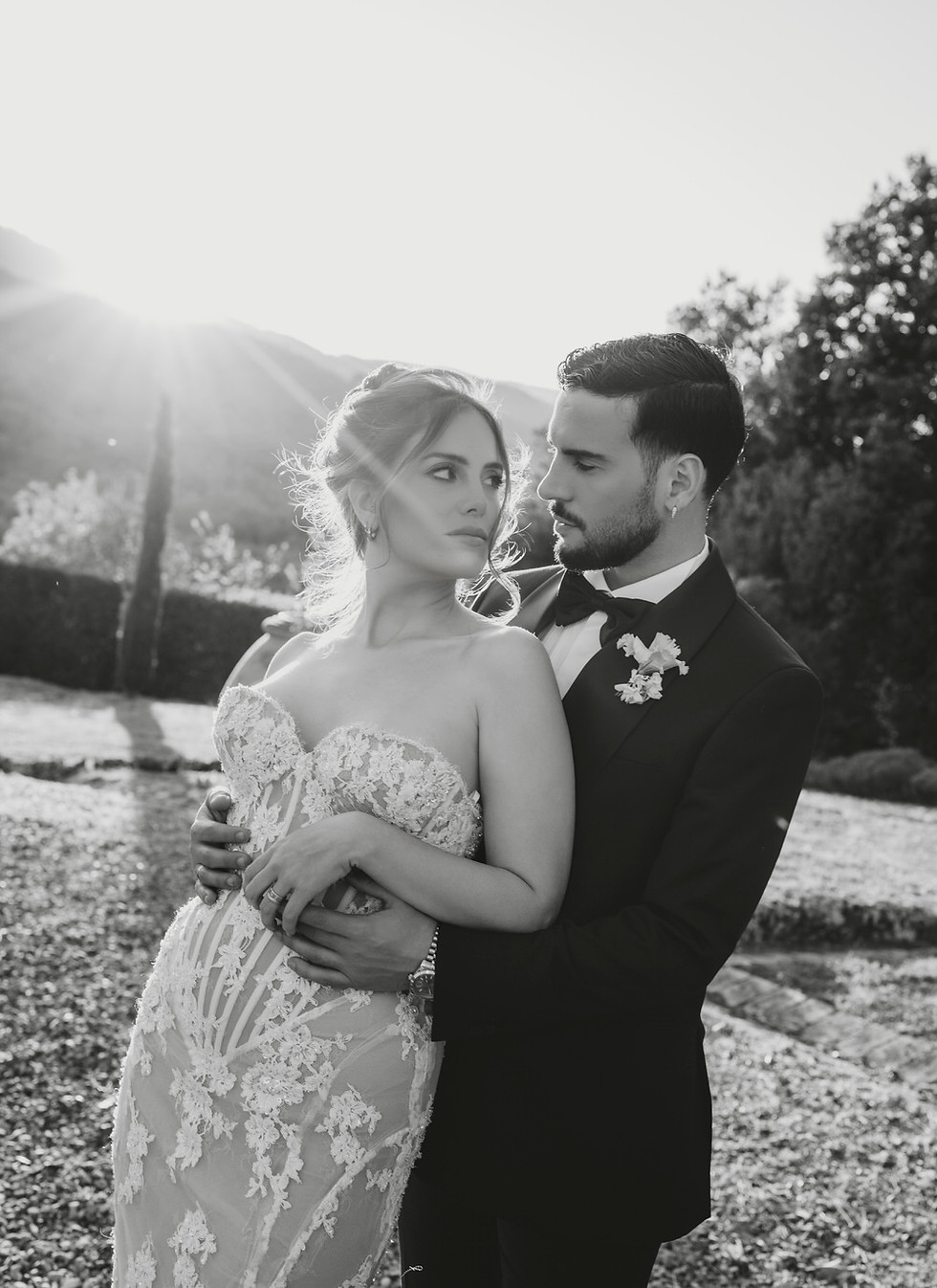 Bride and groom embracing during an intimate wedding moment in an elegant Italian setting