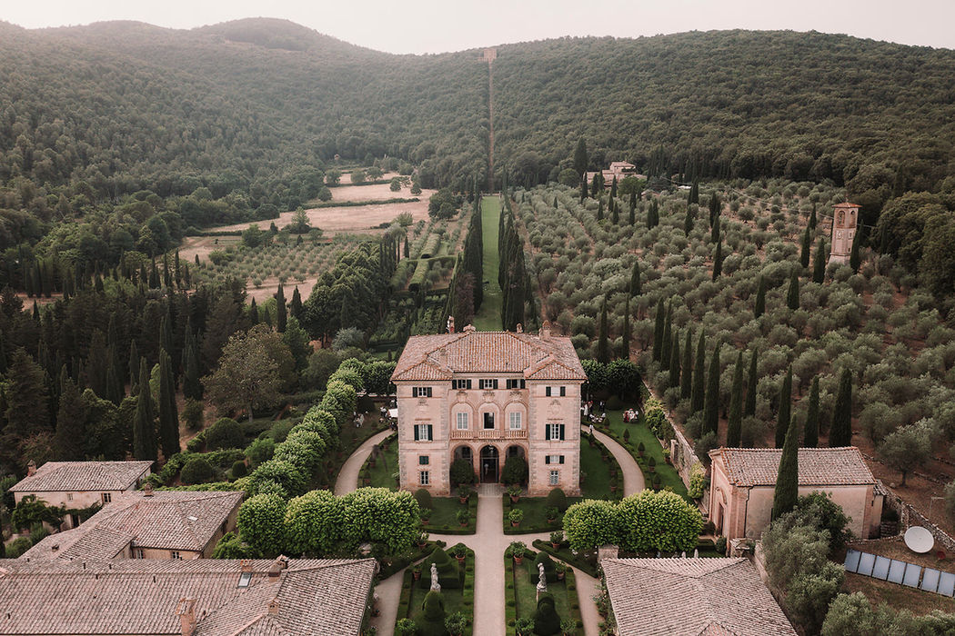 Aerial view of Villa Cetinale estate surrounded by cypress trees and Tuscan hills