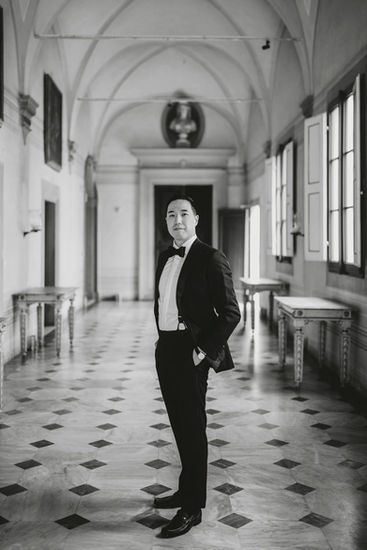 Groom portrait in grand hallway of Tuscan villa