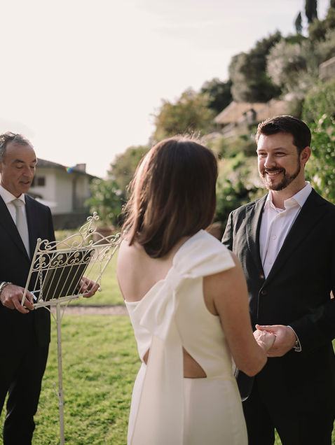 Intimate elopement ceremony in the gardens of Belmond Villa San Michele Florence with officiant and couple exchanging vows