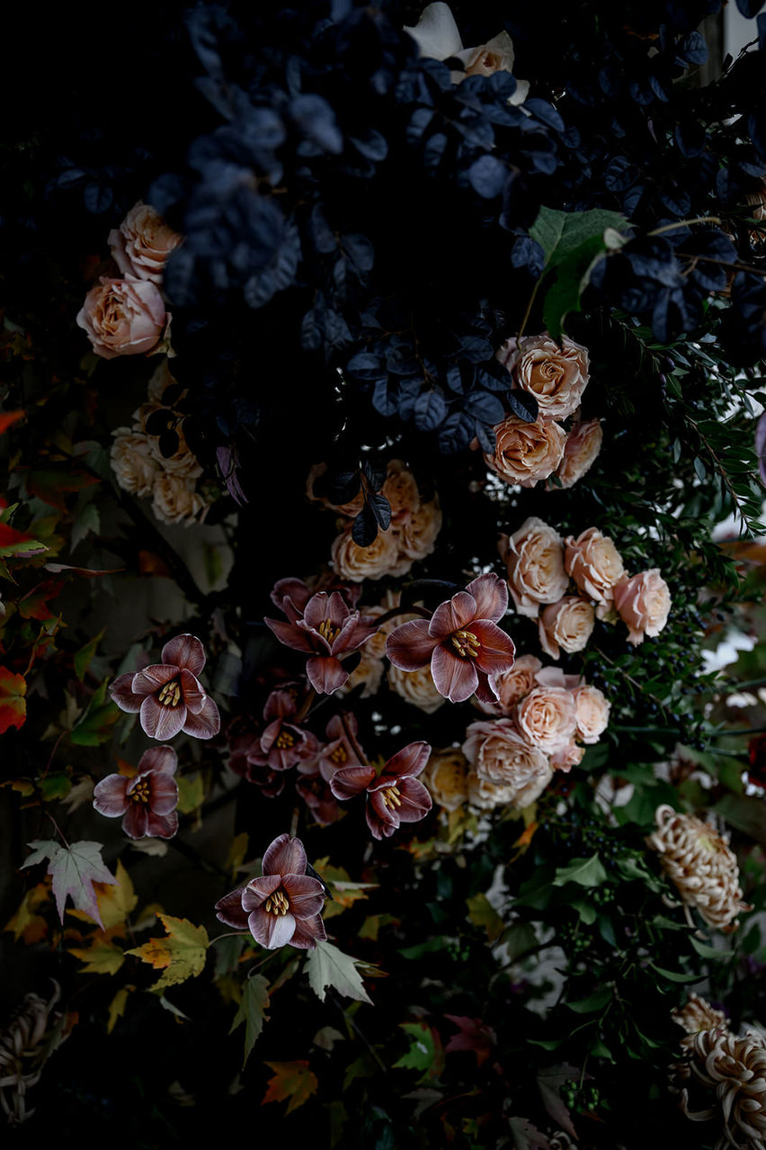 dark romantic floral arrangement for elegant wedding design