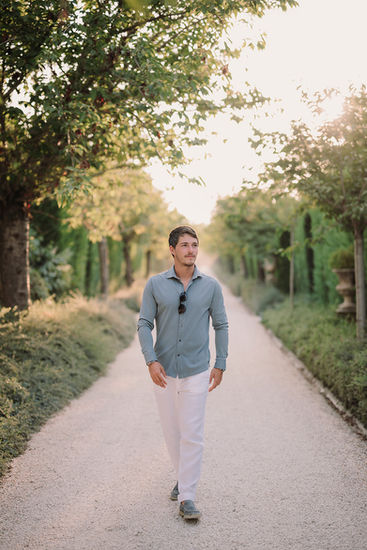 Man walks down path. Alyssa and Sean – Elegant Elopement at Belmond Villa San Michele Florence