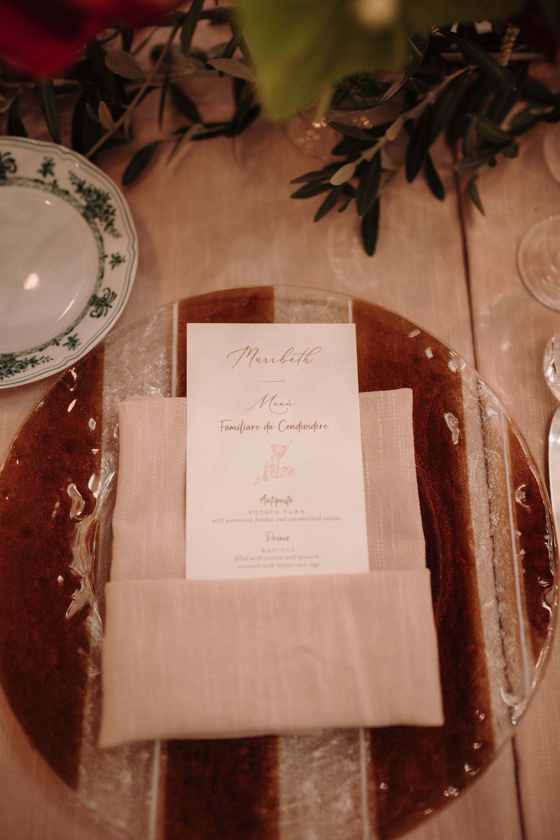 Wedding menu detail on refined reception table at Villa Petrolo