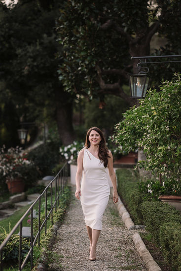Woman wearing white dress walking, Alyssa and Sean elopement at Belmond Villa San Michele Florence 