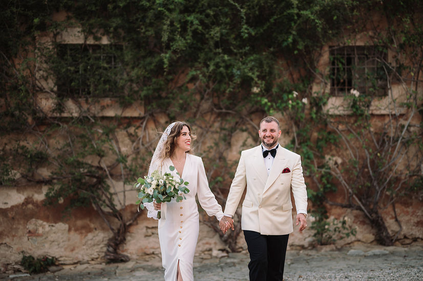 Newlyweds smiling portrait after Villa Catignano ceremony