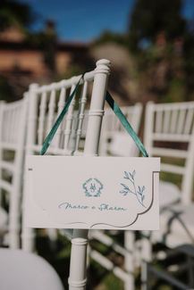 Signage with text Marco e Sharon and floral design, wedding decor, riccardopieri.