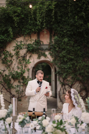 Groom Loris gives speech at reception