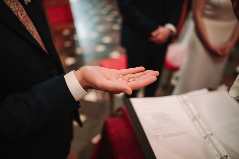 Groom's hand holding wedding rings, wedding ceremony, elegant elopement at Belmond Villa San Michele Florence