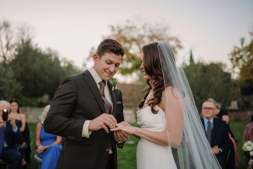 Ring exchange moment with natural light and an intimate atmosphere