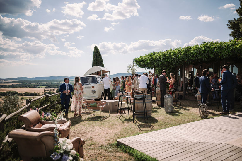 Group of people at a wedding reception outdoor Elegant wedding at Conti di San Bonifacio, Tuscany.