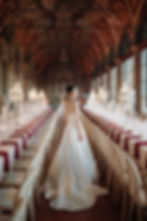 Elegant bride in a white ball gown standing in the grand hall of Villa Corsini, Florence, photographed by Riccardo Pieri during a luxury Tuscan wedding reception.