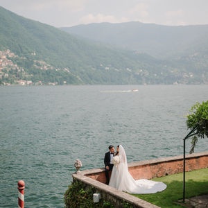 Couple by the lakeside during their wedding at Villa Regina Teodolinda, Lake Como