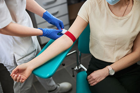 phlebotomy-technician-tightening-the-elastic-band-2024-10-21-23-06-10-utc (1).jpg