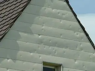 Aluminum siding replacement on a Pittsburgh-area home by Craig Gouker Roofing, showing new exterior installation