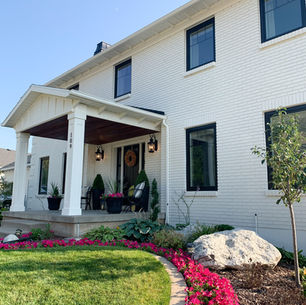 Freshly painted exterior brick home in Greensburg PA showing smooth, even finish after professional painting service