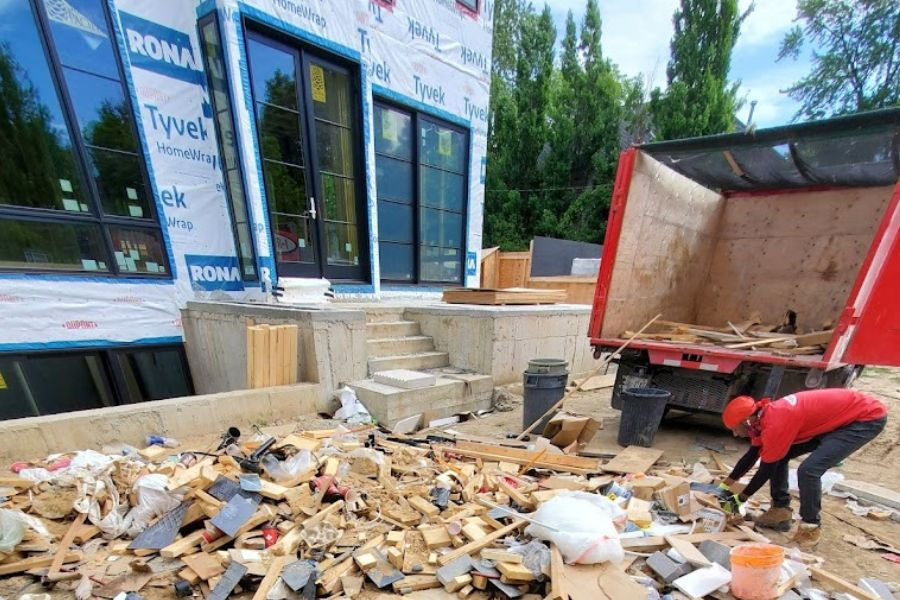 Professional junk removal team safely loading non-hazardous items while following Pennsylvania waste disposal regulations