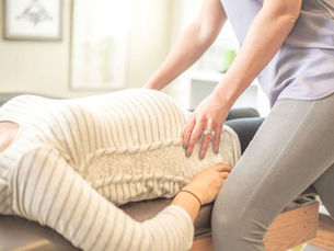 Pregnant woman receiving prenatal chiropractic care at Barto Family Chiropractic in Monroeville PA
