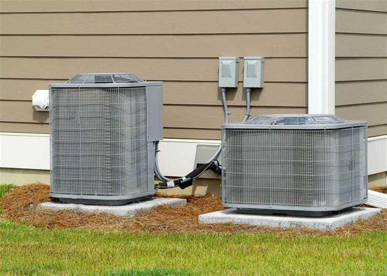 Yeager's Heating & Air Conditioning technician assessing aging furnace for replacement in Cambria County PA home
