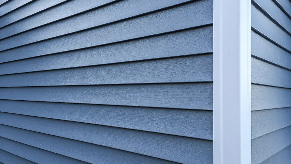 Homeowner comparing exterior contractor quotes for Greensburg PA home improvement project with detailed material specifications