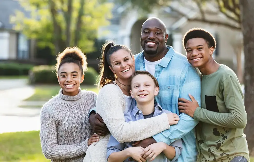Blended family with parents, children and stepchildren on the porch of a Greensburg, Pennsylvania home