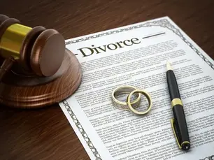 Divorce attorney cost consultation meeting in Greensburg PA law office with legal documents
