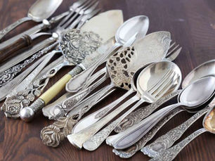 Back of a sterling silver spoon handle showing the STERLING hallmark