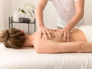 Chiropractor performing chiropractic massage therapy on a patient at a family chiropractic clinic in Monroeville PA