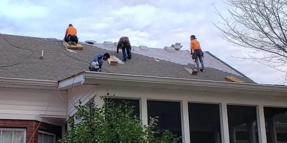Professional roofer installing new roof showing how long does new roof last Pittsburgh with quality materials