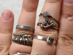 Tarnished silver jewelry pieces showing natural darkening process that affects surface appearance but not underlying value