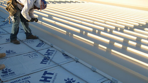 Peel and stick underlayment roll on a residential roof deck in Western Pennsylvania winter conditions