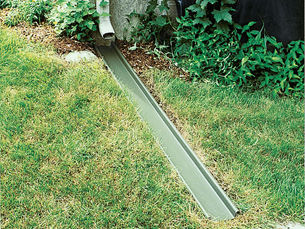 Gutter downspout extension directing water away from a Pittsburgh home foundation