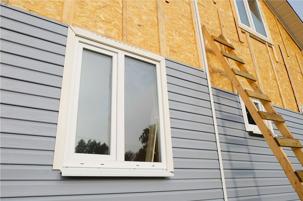 Warped and deteriorating vinyl siding on a Pittsburgh-area home showing signs that replacement is needed