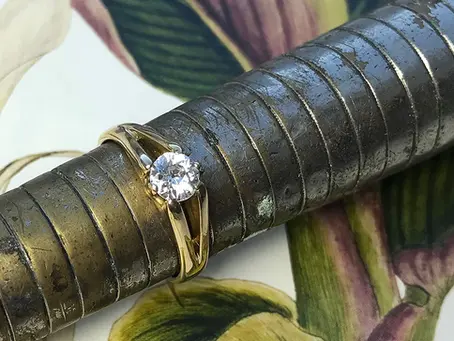 A jeweler resizing a gold ring at a workbench in a downtown Greensburg PA jewelry studio