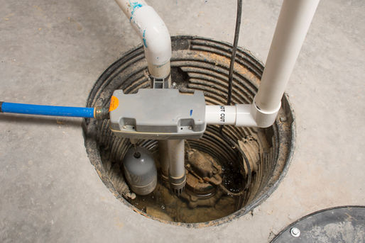 Licensed plumber performing sump pump installation in a Bethel Park PA basement