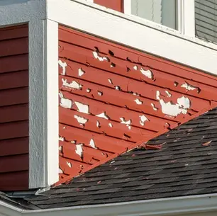 Homeowner examining roof age documentation and permits to determine installation date for insurance and resale purposes